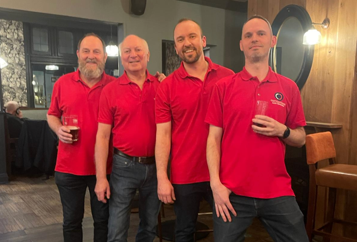 Four barbershoppers performing as a quartet
